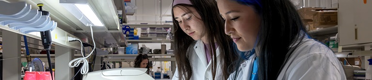 Two girls doing research in the lab.